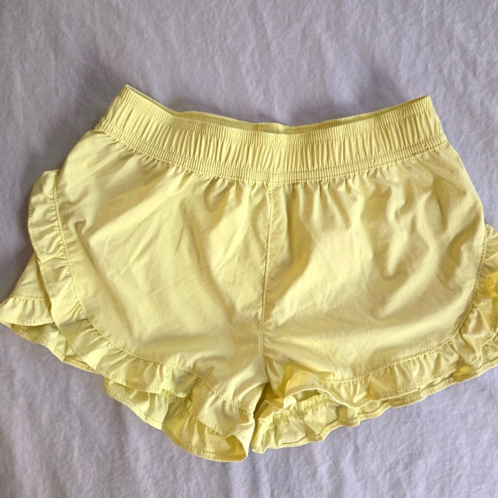 Crewcuts Girls Pastel Yellow Dolphin Hem Ruffle Shorts